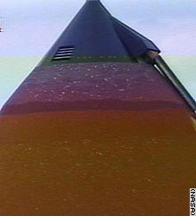 image of the hail damage on the Shuttle's external tank