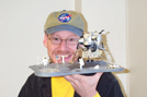 close-up image of Dr. Plait holding Apollo 11 model